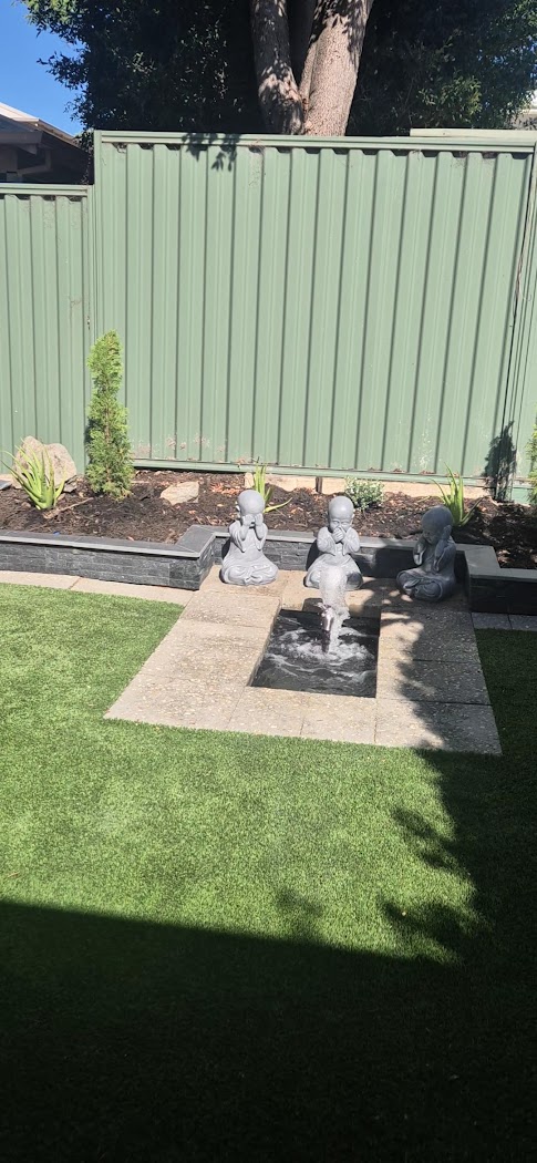 Backyard build with paving, water feature and retaining wall